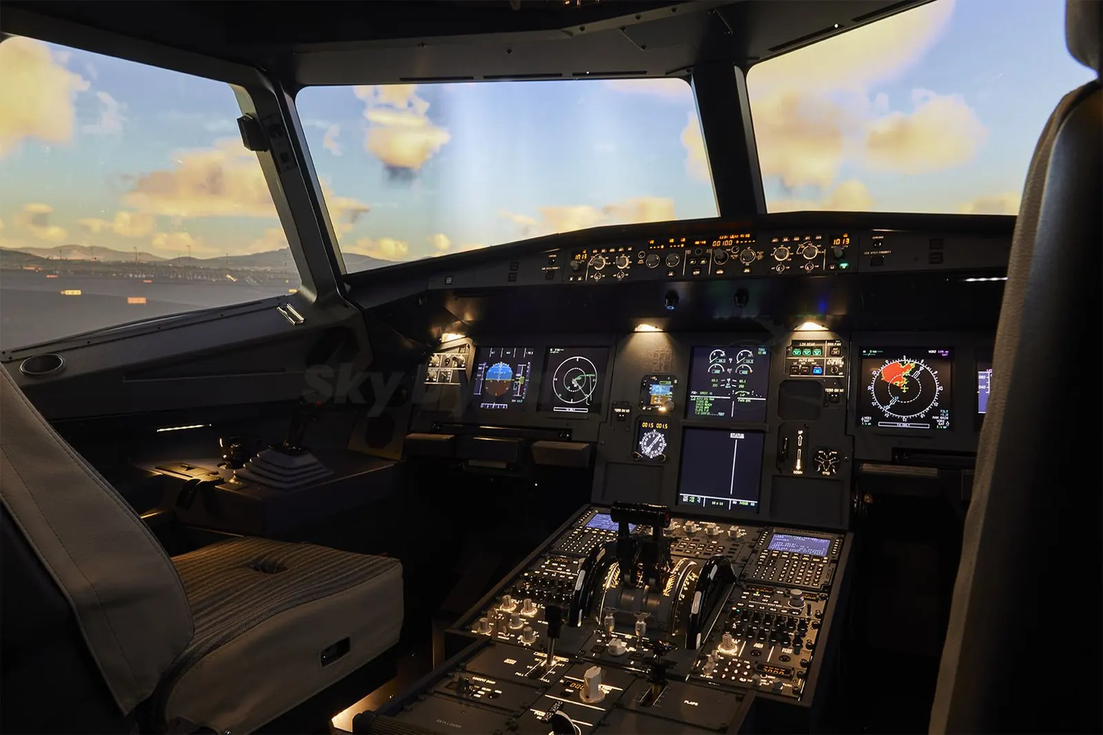 Flight deck of a SkyDynamics A320 FNPT II simulator with the visual system running